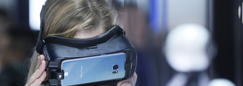 An attendee tries out a VR headset at CES 2017